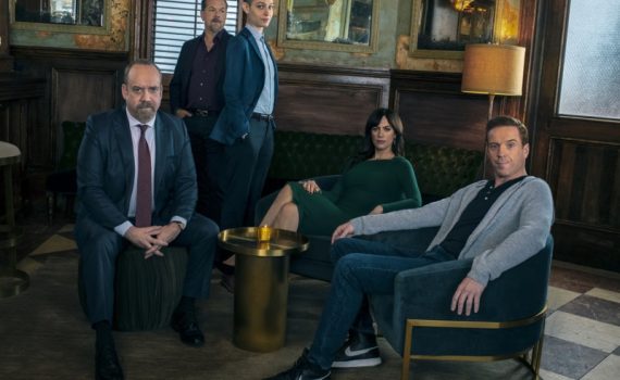 Cast of Billions on Showtime Sitting in an Office