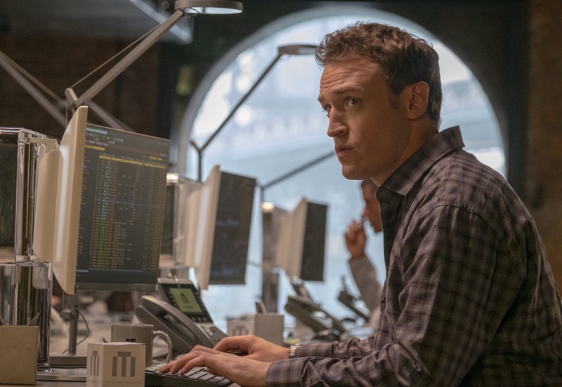Dudley Mafee from Showtime's Billions typing at desk with computer