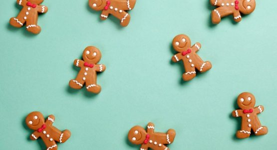 gingerbread men for christmas against a green background