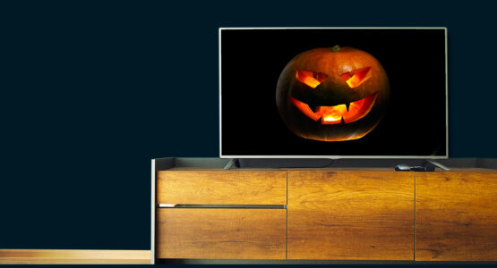 A scary pumpkin on a TV