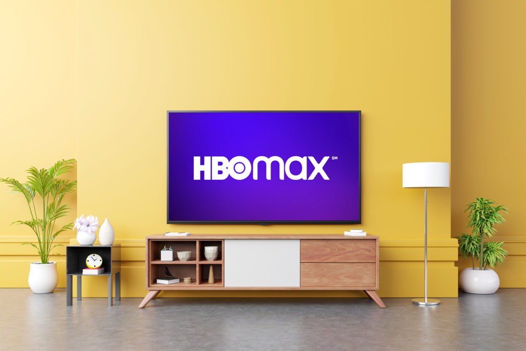 HBO Max on a television hanging on a living room wall