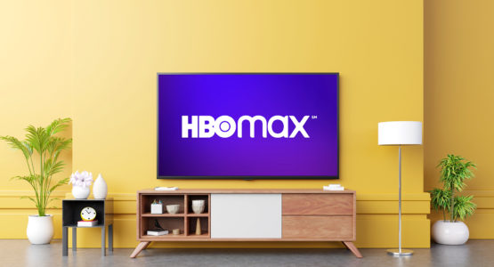 HBO Max on a television hanging on a living room wall