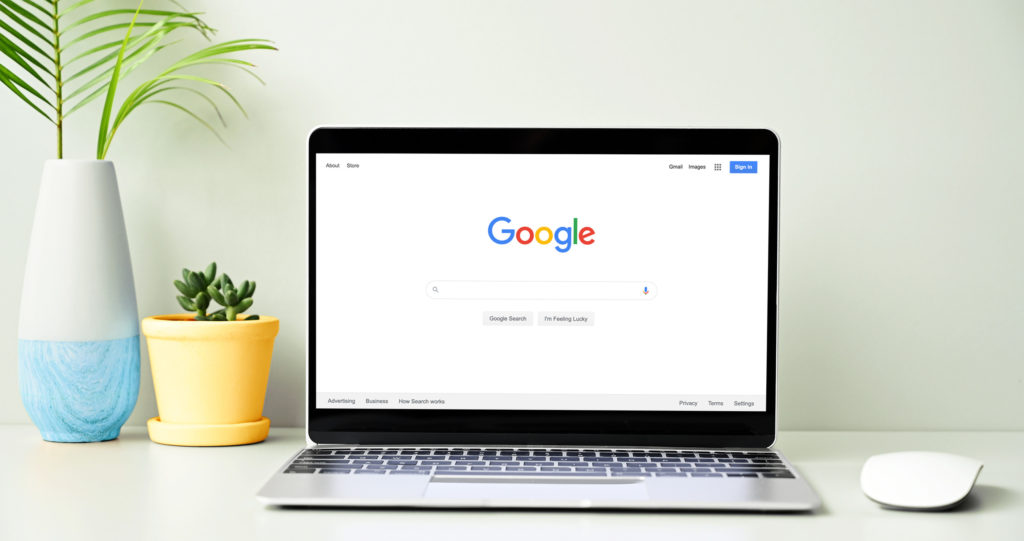 Google search screen on a laptop sitting on a desk